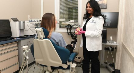 Dentist and patient discussing options for dental treatment